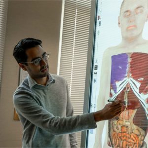 man using anatomy table