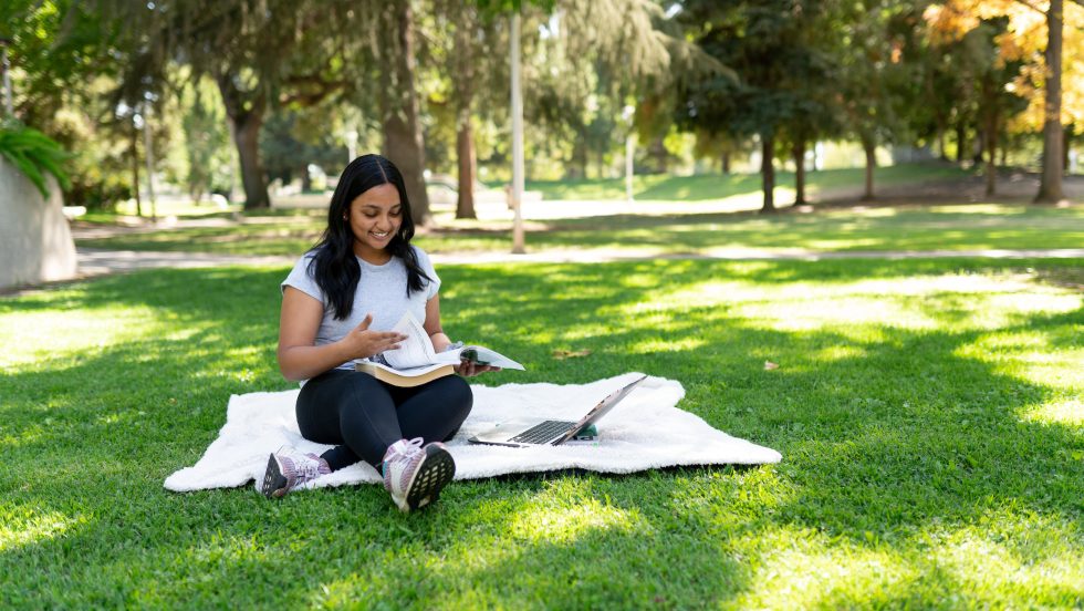 student studying on campus