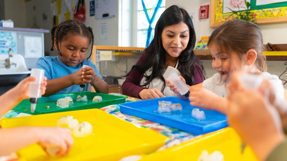 student teach children in child development center