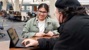 student help desk technician helping student