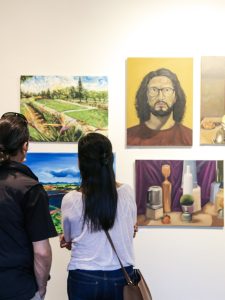 people viewing the campus art gallery