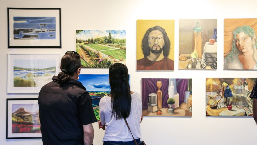 people viewing the campus art gallery