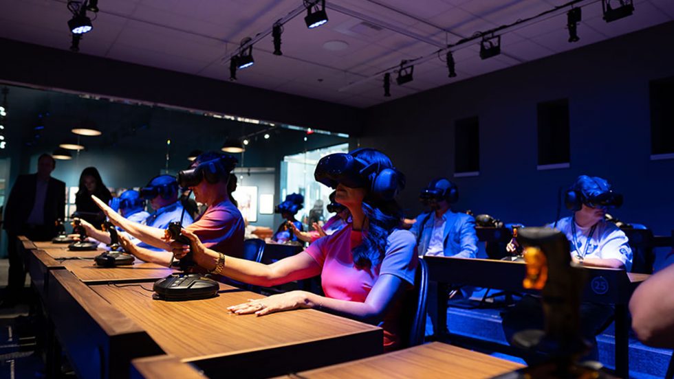A group of invited guests testing out Dreamscape classroom virtual reality headset equipment